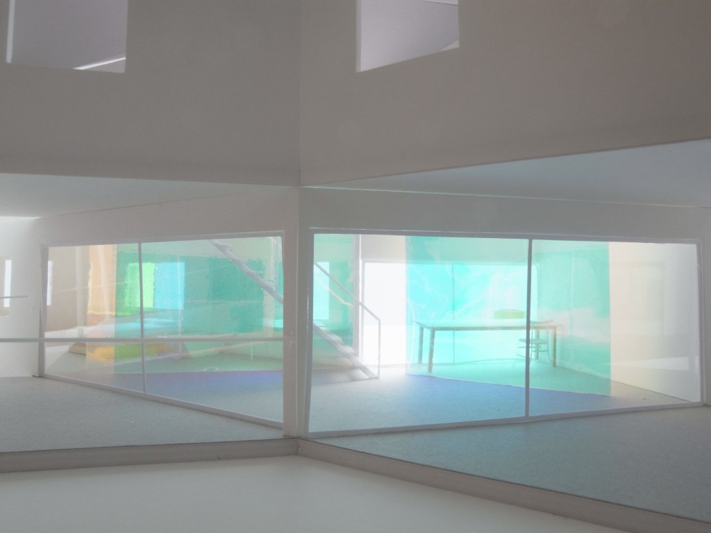 A prism of angled glass in the intersection of the X.