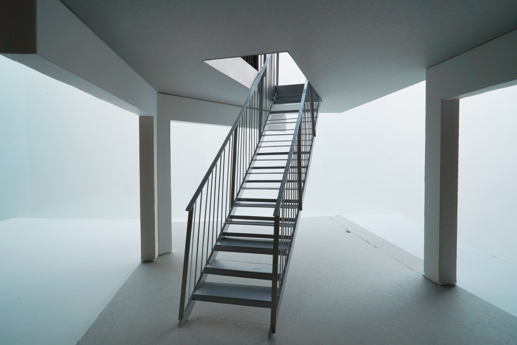 The galvanised steel stairs up to the kitchen.