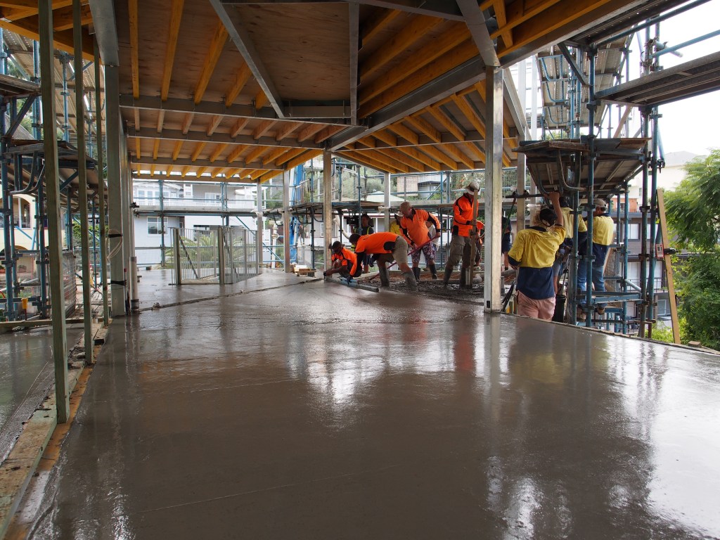 The suspended slab being poured on the lower floor.