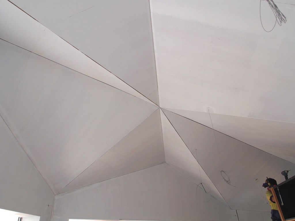 Ceiling primed, gaps prior to filling.