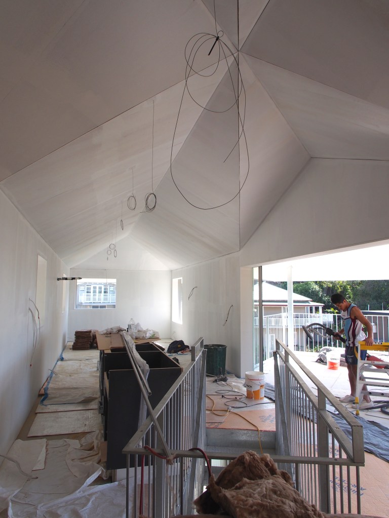 Walls and ceiling primed for painting.