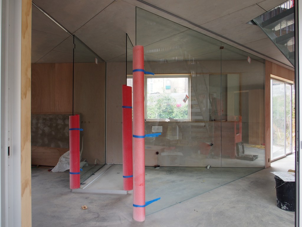 The glass bathroom as seen from the front door. Cheeky.